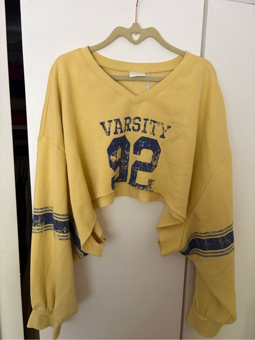 urban outfitters out from under cropped varsity sweatshirt in yellow